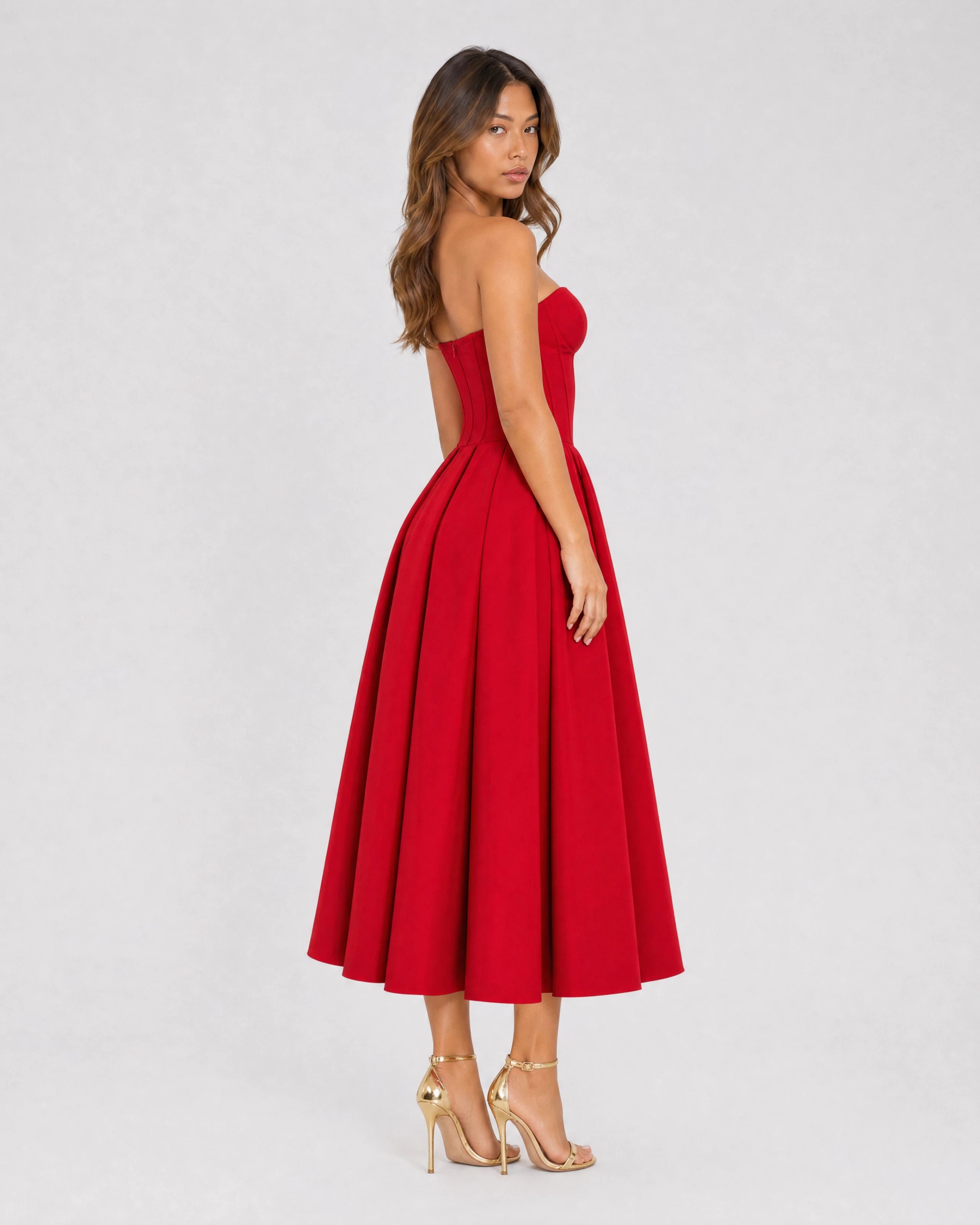 Adeline red corset midi dress with full pleated skirt - three-quarter back view