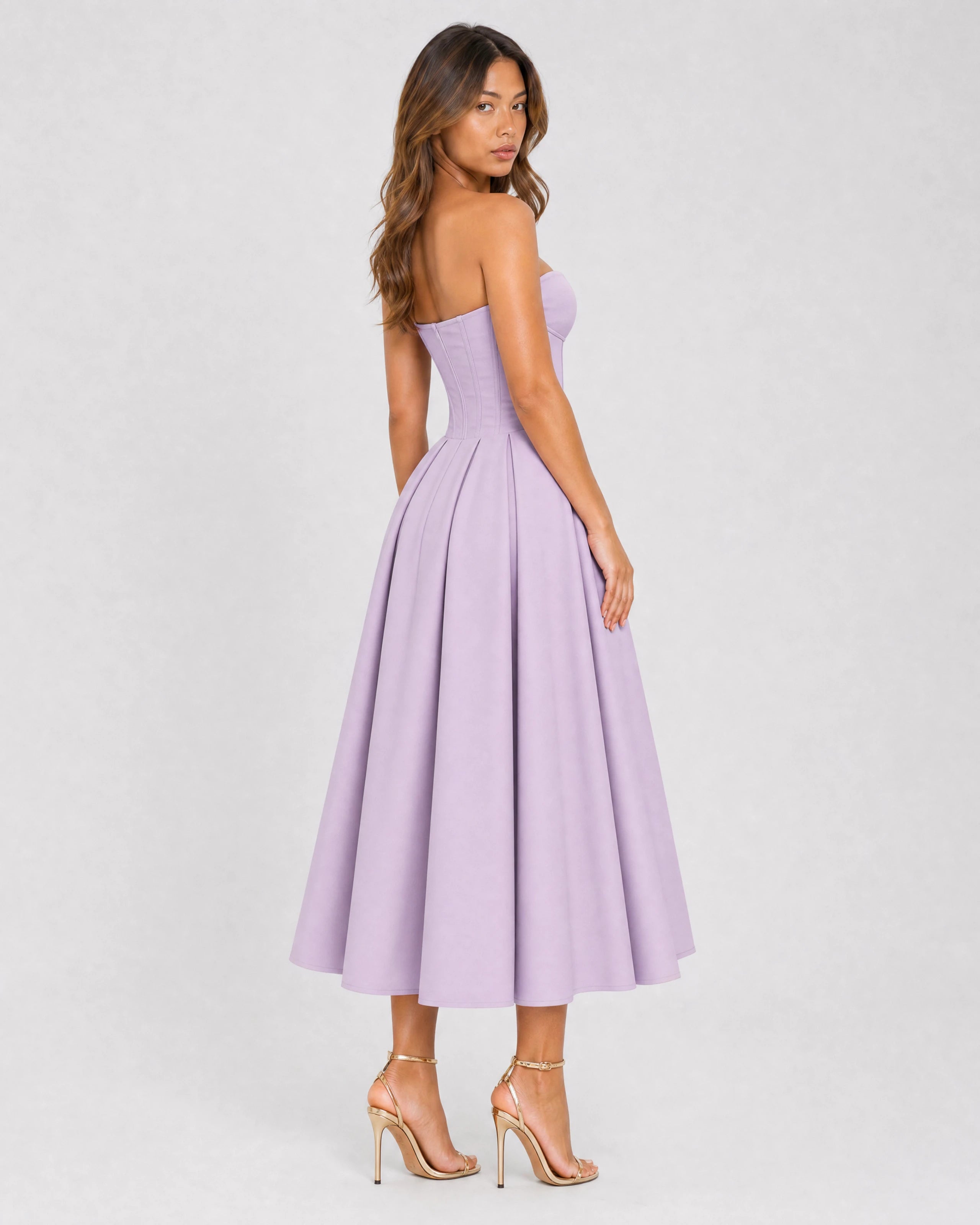 Adeline violet corset midi dress with full pleated skirt - three-quarter back view