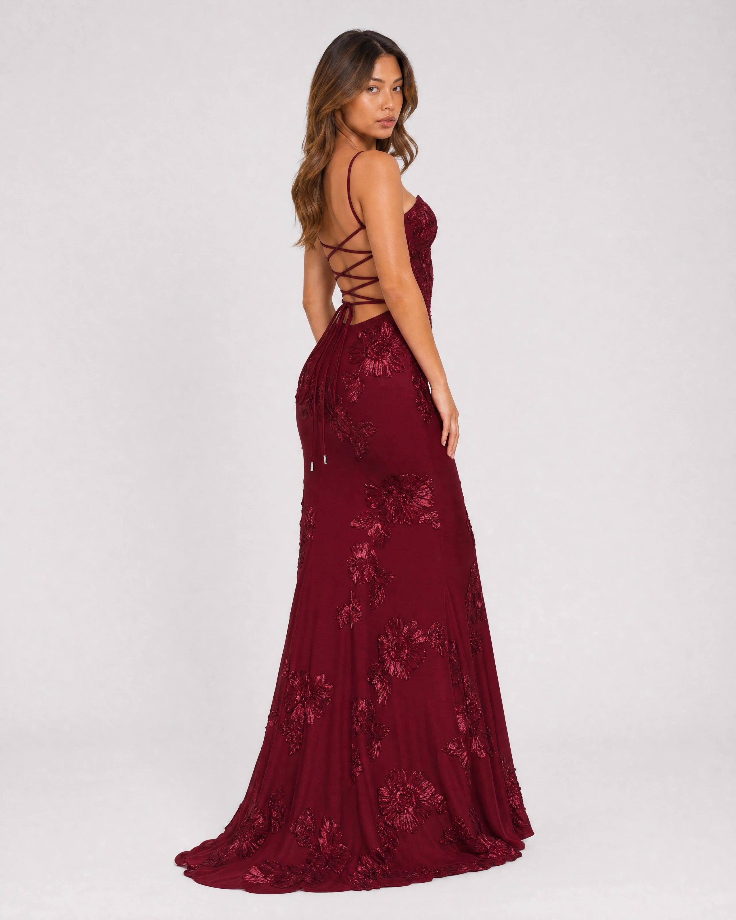 Flora embroidered floral mermaid gown in burgundy, three-quarter back with lace-up