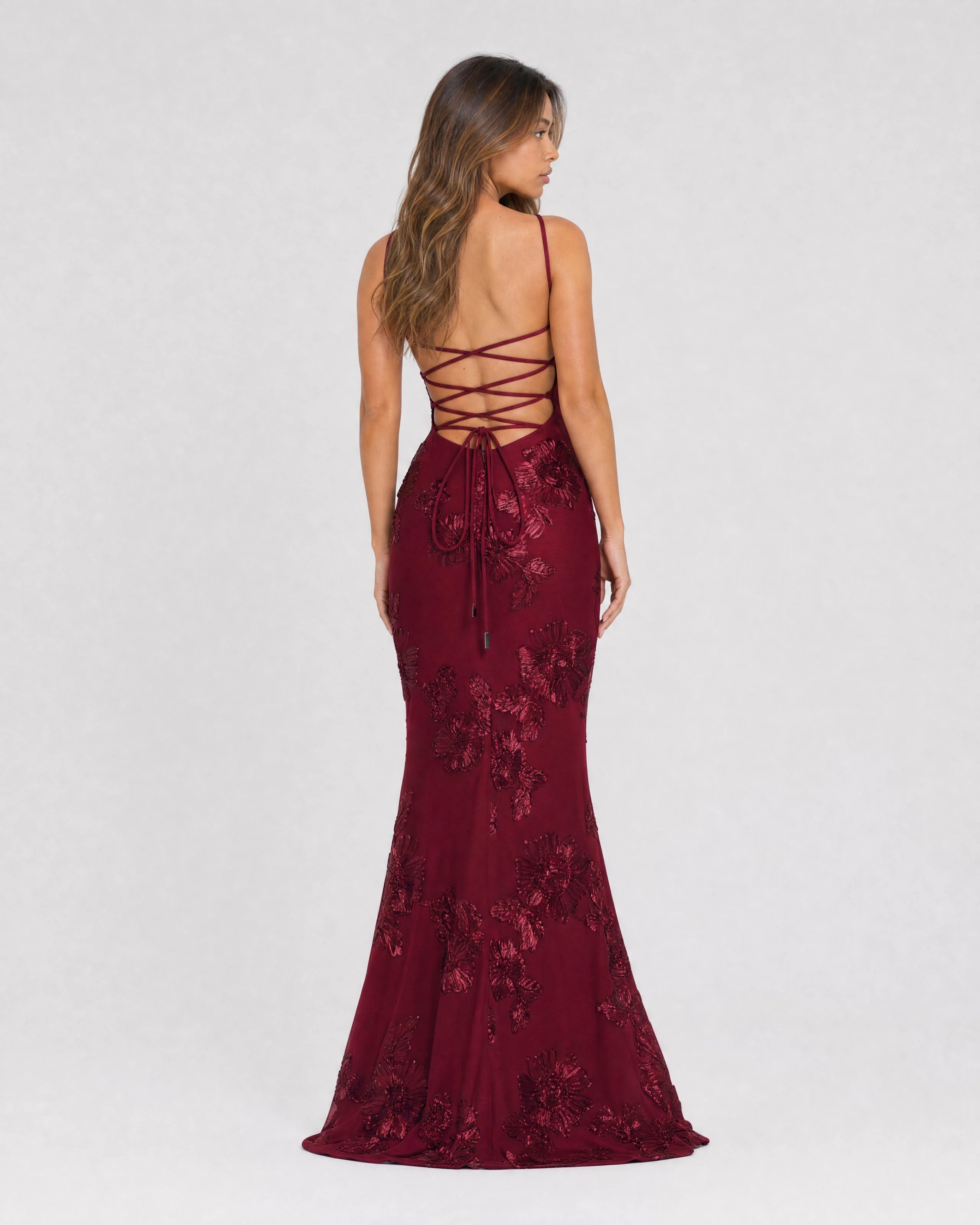 Flora embroidered floral mermaid gown in burgundy, back view with lace-up