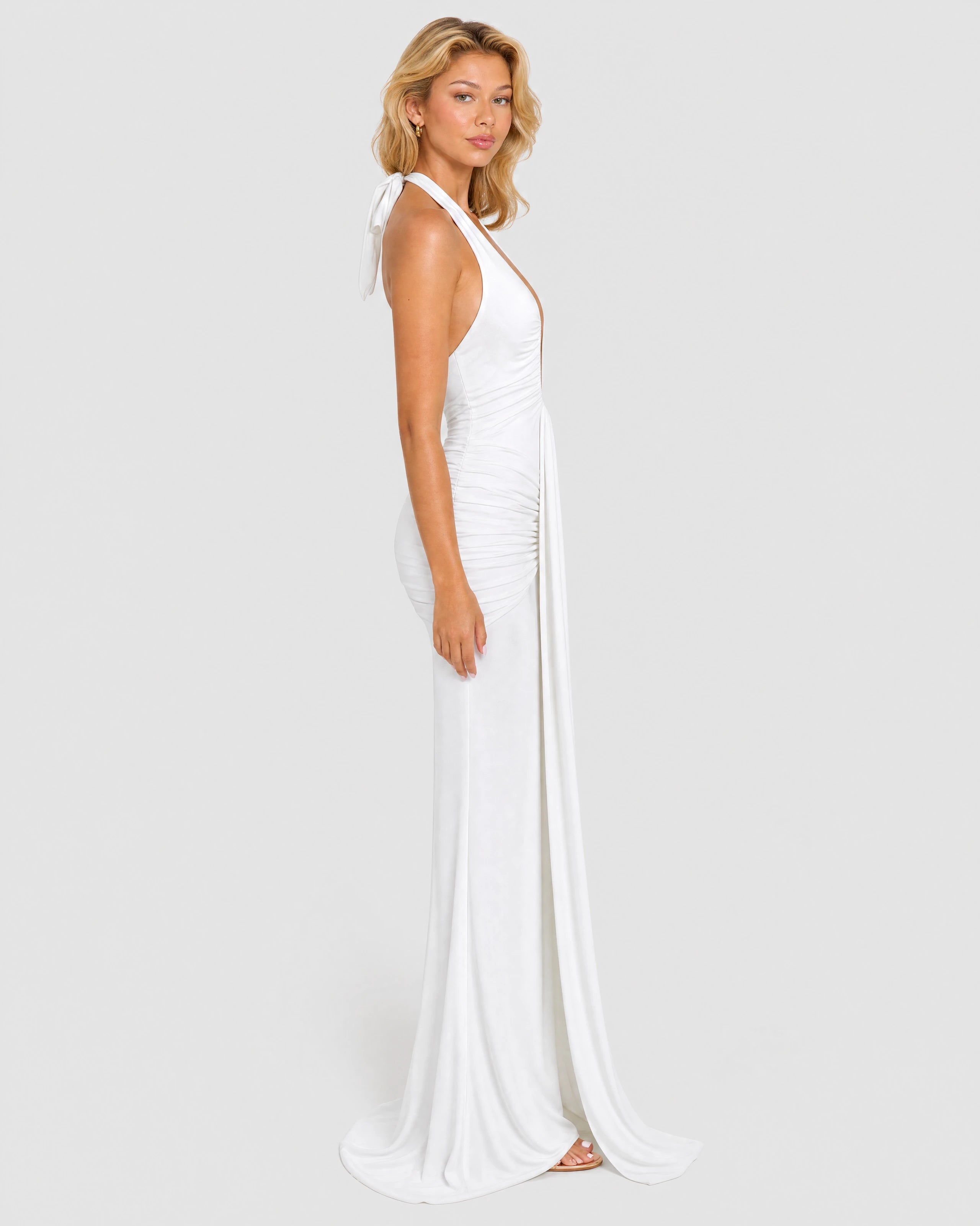 Liliane white plunge halter maxi dress - side profile with train